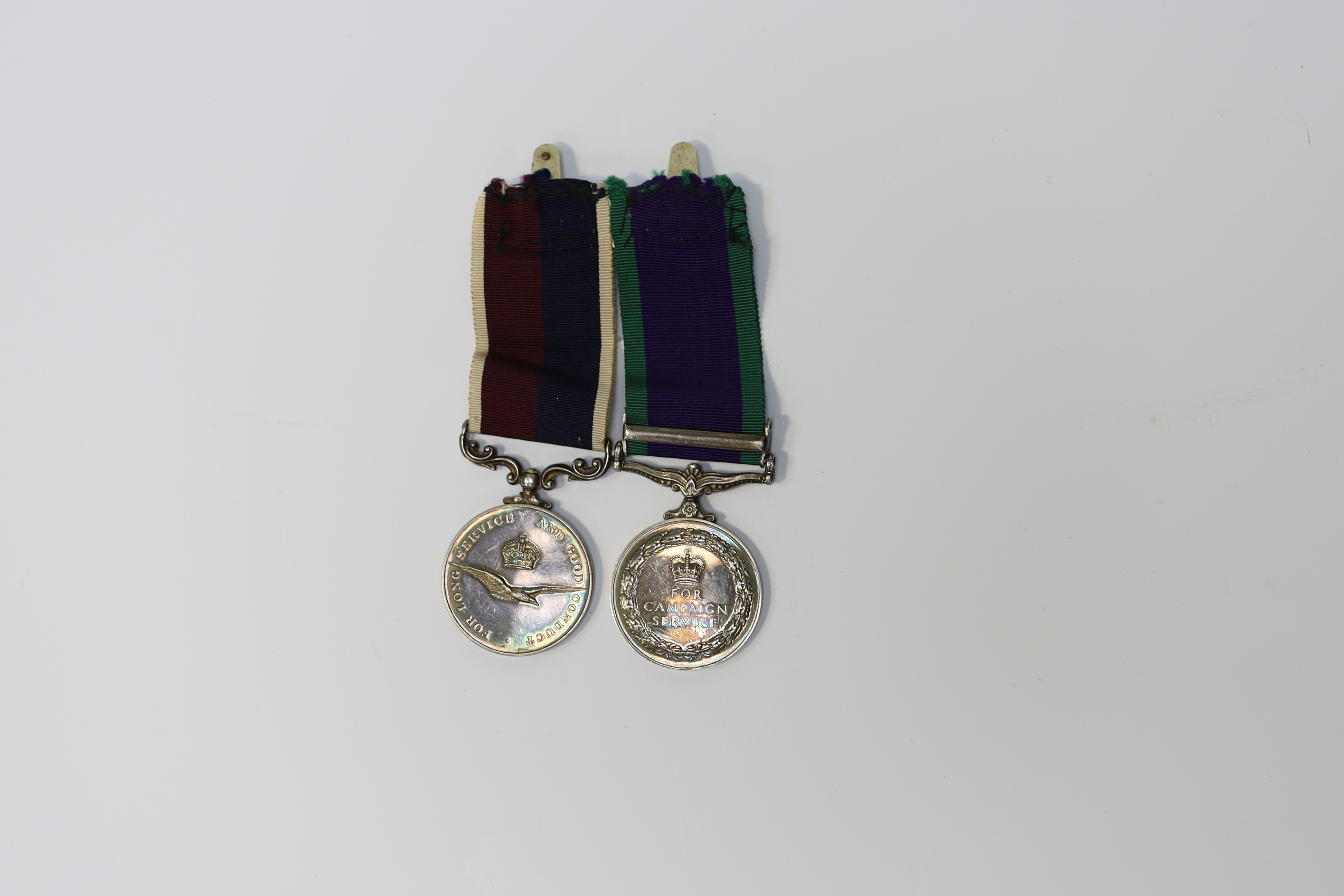 An ERII RAF medal pair awarded to Cpl. A.F.G. Pitcher RAF, comprising; a General Service Medal with a bar for Borneo and an RAF Long Service Medal, mounted on a common pin. Condition - fair to good